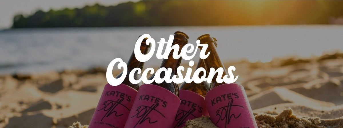 stubbies in personalised stubby coolers in sand on beach in golden hour